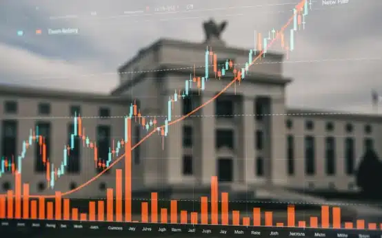 Federal Reserve building with financial charts showing rising interest rates